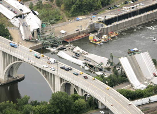 An aerial view of a bridge that has collapsed.